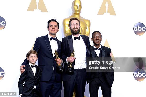 Producer Shan Christopher Ogilvie and director Benjamin Cleary , winners of the Best Live Action Short award for 'Stutterer,' pose with actors Jacob...