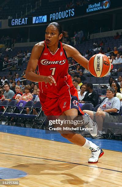 Tina Thompson of the Houston Comets drives to basket in a game against the Washington Mystics on September 12, 2004 at the MCI Center in Washington...
