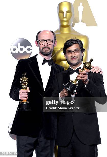 Filmmakers James Gay-Rees and Asif Kapadia, winners of the Best Documentary Feature award for 'Amy,' pose in the press room during the 88th Annual...