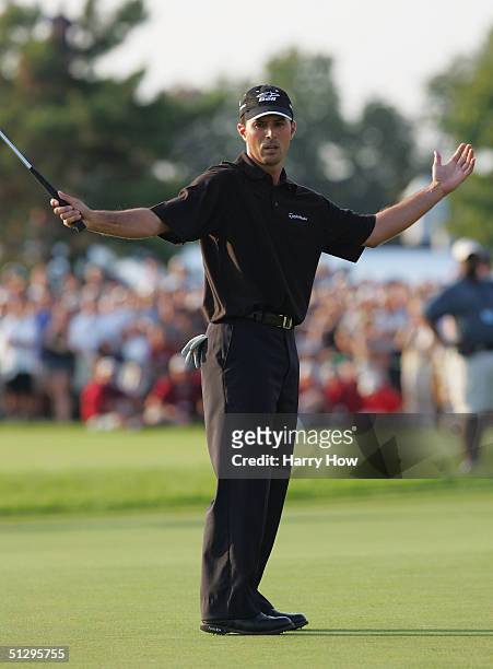 Mike Weir of Canada reacts to his missed putt on the 18th green on the first playoff hole during the final round of the Canadian Open at the Glen...