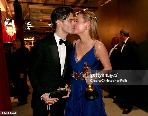 Actress Brie Larson , winner of Best Actress for 'Room,' and musician Alex Greenwald backstage at the 88th Annual Academy Awards at Dolby Theatre on...