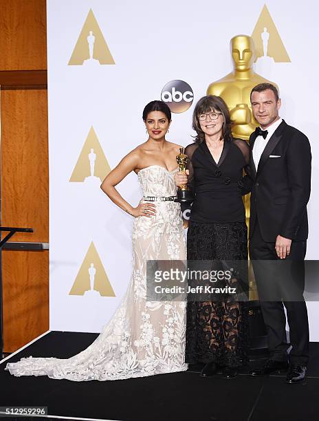 Actress Priyanka Chopra, editor Margaret Sixel winner of the Best Film Editing award for 'Mad Max: Fury Road,' and actor Liev Schreiber pose in the...