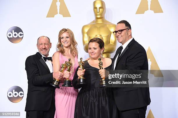 Producers Steve Golin, Nicole Rocklin, Blye Pagon Faust, and Michael Sugar, winners of Best Picture for "Spotlight," pose in the press room during...