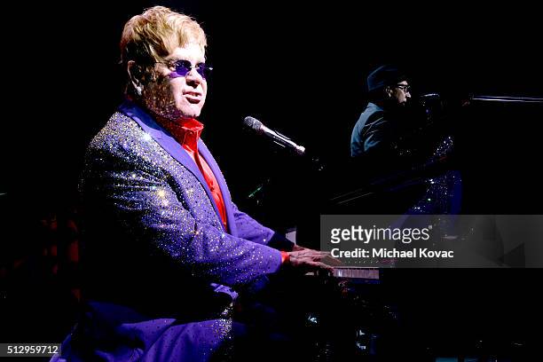 Host Sir Elton John performs onstage during the 24th Annual Elton John AIDS Foundation's Oscar Viewing Party at The City of West Hollywood Park on...