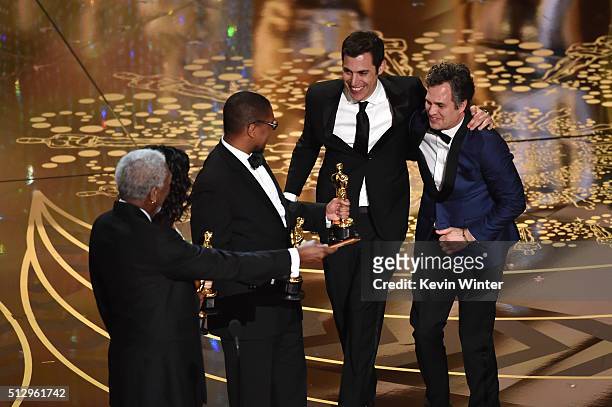 Screenwriter Josh Singer and actor Mark Ruffalo of Best Picture winner 'Spotlight' celebrate onstage with actor Morgan Freeman during the 88th Annual...