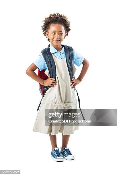 cute private school kindergarten student standing with hands on hips - beautiful ethiopian girls stockfoto's en -beelden