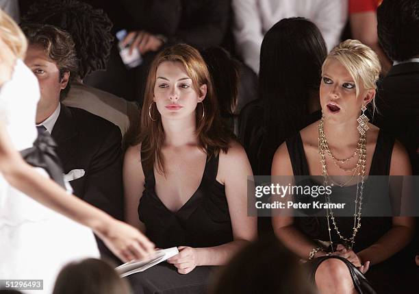 Actress Anne Hathaway and singer Jessica Simpson attend the Luca Luca Couture Spring 2005 fashion show during the Olympus Fashion Week Spring 2005 at...