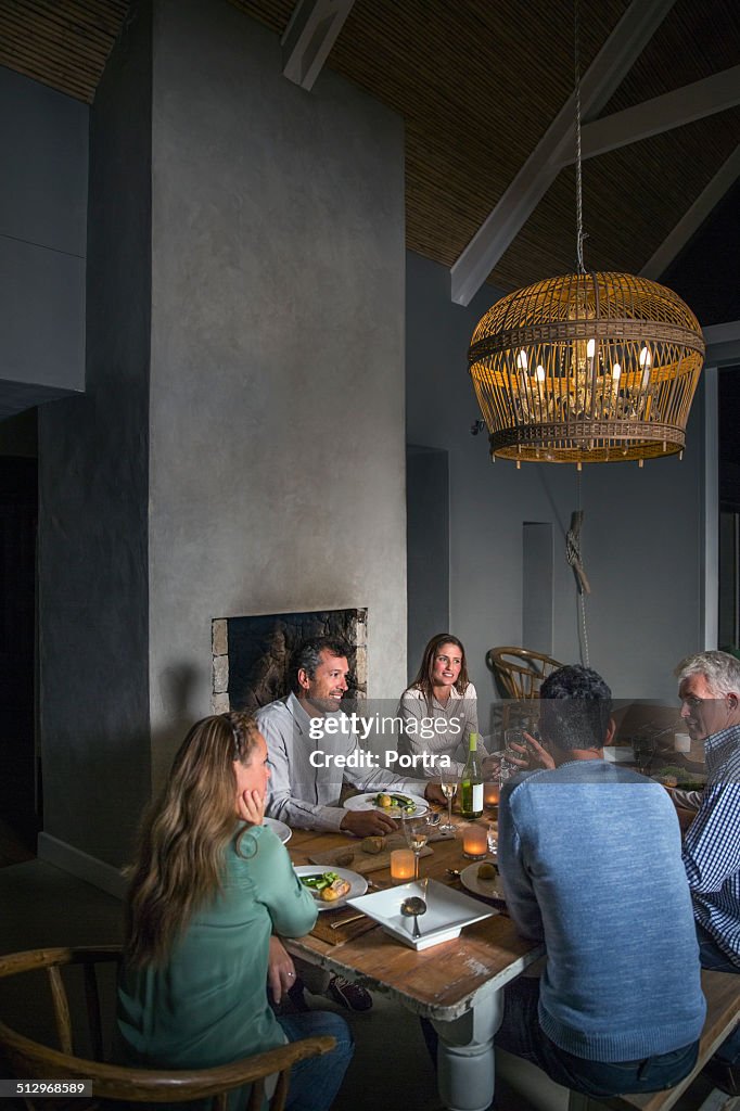 Friends communicating while having dinner