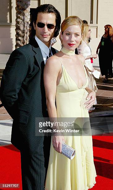 Actors Christina Applegate and husband Johnathon Schaech arrive at the 2004 Primetime Creative Arts Emmy Awards at the Shrine Auditorium on September...