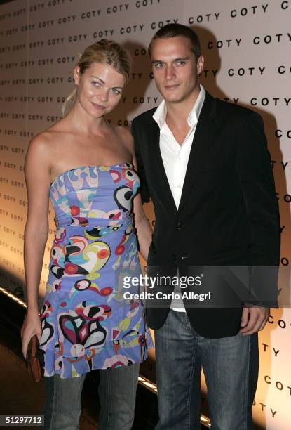 Model Gemma Kidd and guest attend the Coty 100th Anniversary Party on September 12, 2004 at the American Museum of Natural History, in New York City.