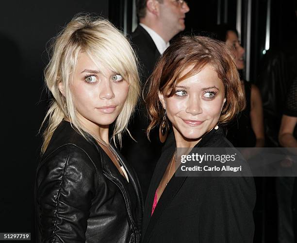 Actresses Ashley and Mary-Kate Olsen attend the Coty 100th Anniversary Party on September 12, 2004 at the American Museum of Natural History, in New...