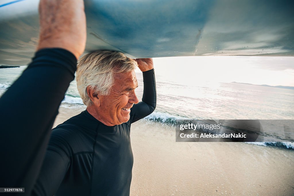 Smiling senior surfer