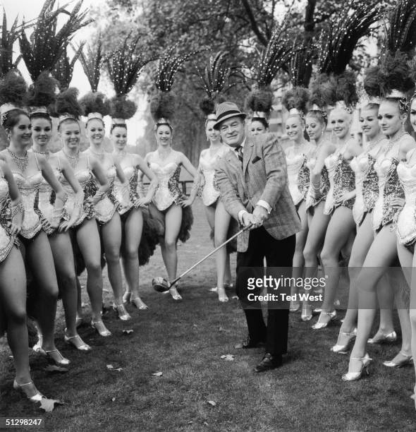 British-born comedian and actor Bob Hope with members of the Bluebell Girls dance troupe outside the Dorchester Hotel, London, 11th November 1967....