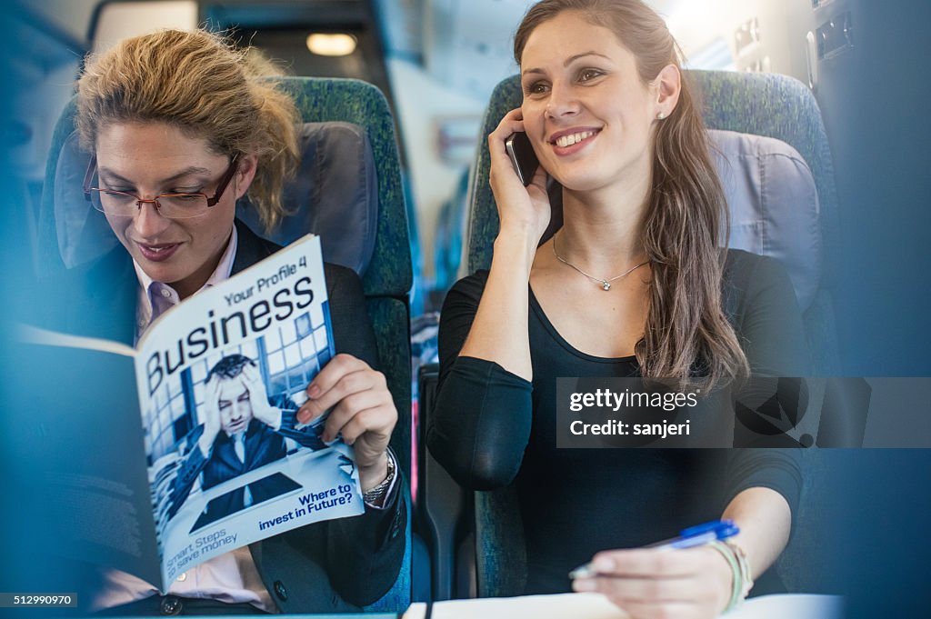 Businesswoman having meeting on the train
