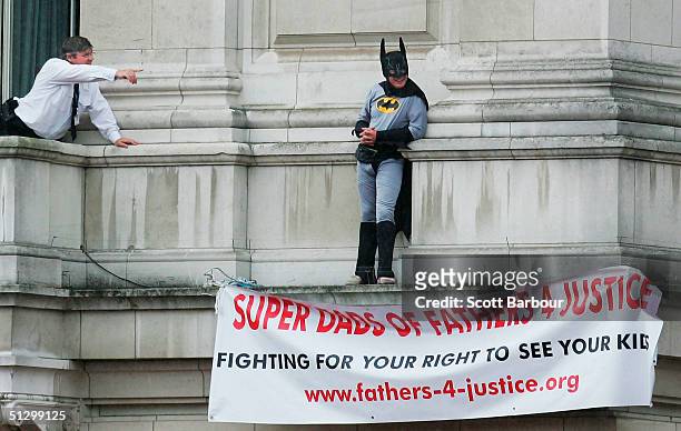 Jason Hatch , a Fathers 4 Justice campaigner dressed as Batman protests on the balcony at Buckingham Palace on September 13, 2004 in London, England....