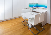Modern kitchen counter top with dining table,chairs