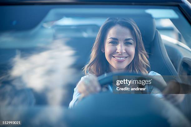 woman driving a car - car driving away stock pictures, royalty-free photos & images