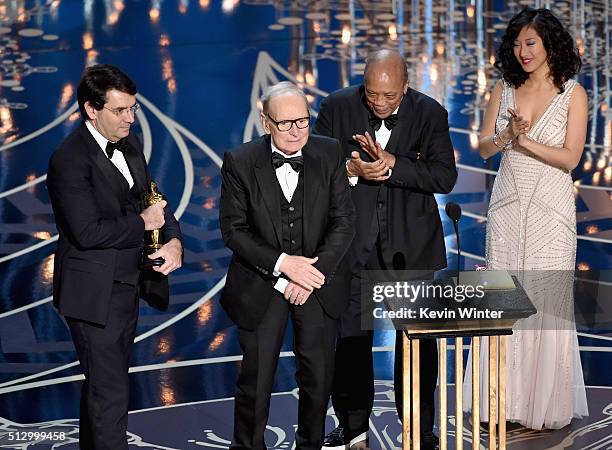 Composer Ennio Morricone accepts the Best Original Score award for ''The Hateful Eight' from musician Quincy Jones onstage during the 88th Annual...
