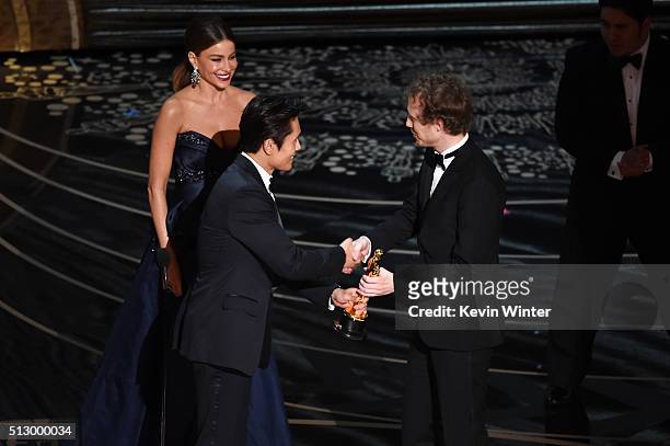 Director Laszlo Nemes accepts the Best Foreign Language Film award for 'Son of Saul' from actors Sofia Vergara and Byung-hun Lee speak onstage during...