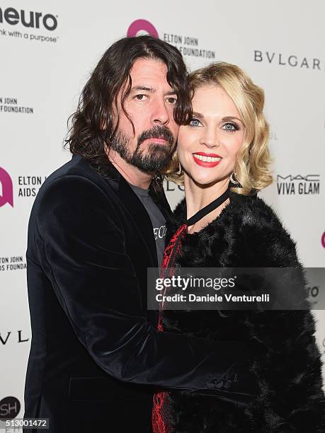 Musician Dave Grohl and Jordyn Blum attend Bulgari at the 24th Annual Elton John AIDS Foundation's Oscar Viewing Party at The City of West Hollywood...