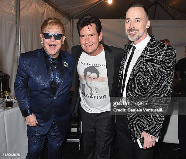 Host Elton John, actor Charlie Sheen and host David Furnish attend Bulgari at the 24th Annual Elton John AIDS Foundation's Oscar Viewing Party at The...