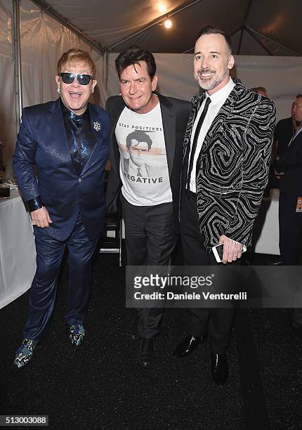 Host Elton John, actor Charlie Sheen and host David Furnish attend Bulgari at the 24th Annual Elton John AIDS Foundation's Oscar Viewing Party at The...