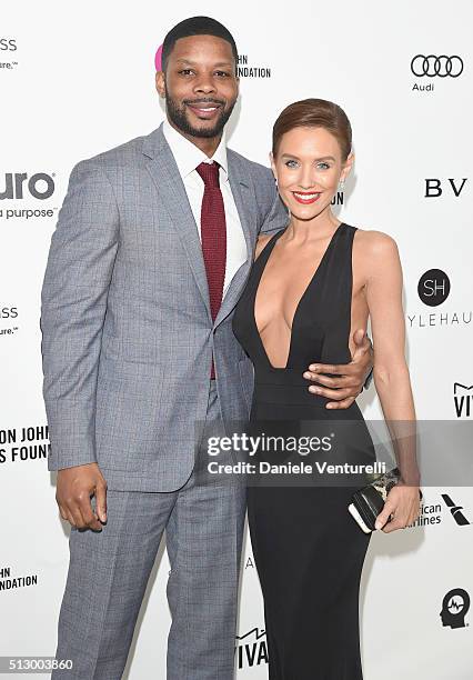 Actress Nicky Whelan and guest attend Bulgari at the 24th Annual Elton John AIDS Foundation's Oscar Viewing Party at The City of West Hollywood Park...