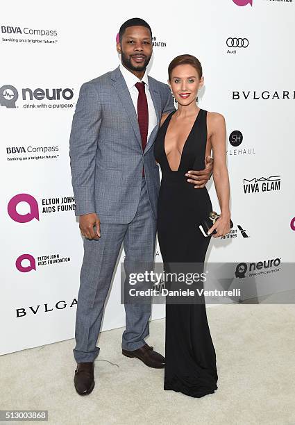 Actress Nicky Whelan and guest attend Bulgari at the 24th Annual Elton John AIDS Foundation's Oscar Viewing Party at The City of West Hollywood Park...