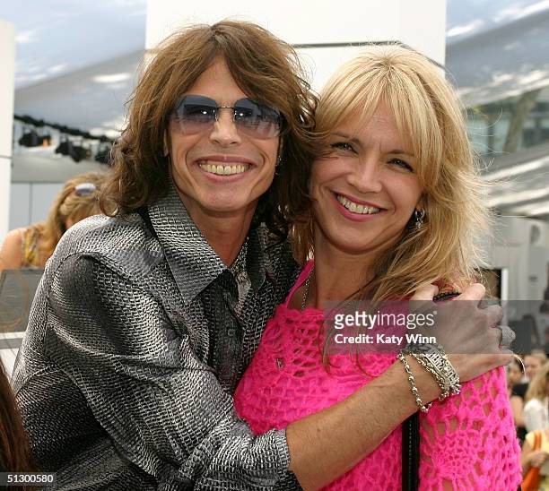 Singer Steven Tyler and wife Teresa Barrick are seen during the Olympus Fashion Week Spring 2005 at Bryant Park September 13, 2004 in New York City.