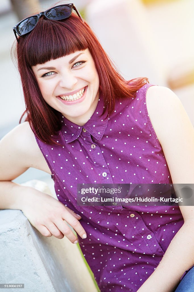 Young woman in purple blouse laughing merrily, Osijek, Croatia