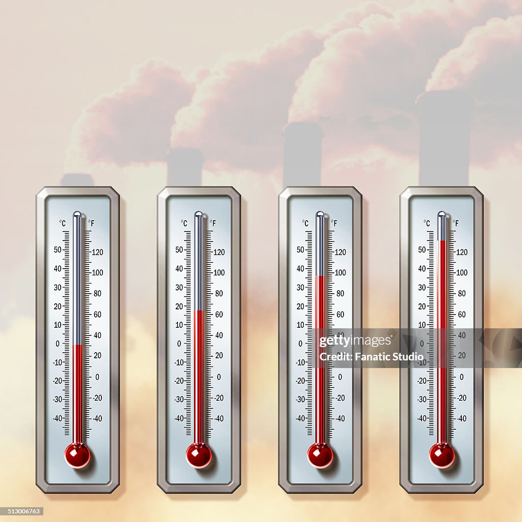 Illustrative image of thermometers showing rising temperatures with smoke emitting from chimneys representing global warming