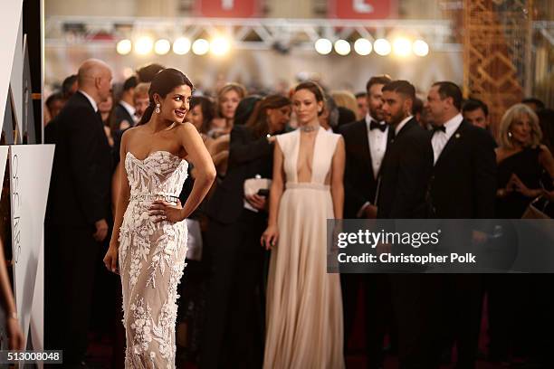 Actresses Priyanka Chopra and Olivia Wilde attend the 88th Annual Academy Awards at Hollywood & Highland Center on February 28, 2016 in Hollywood,...