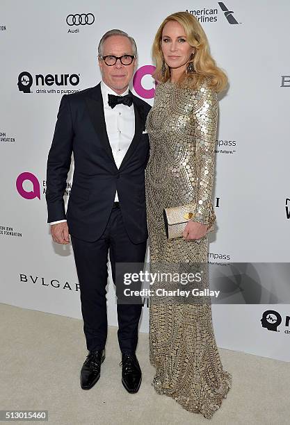 Fashion designer Tommy Hilfiger and Dee Ocleppo attend Neuro at the 24th Annual Elton John AIDS Foundation's Oscar Viewing Party at The City of West...