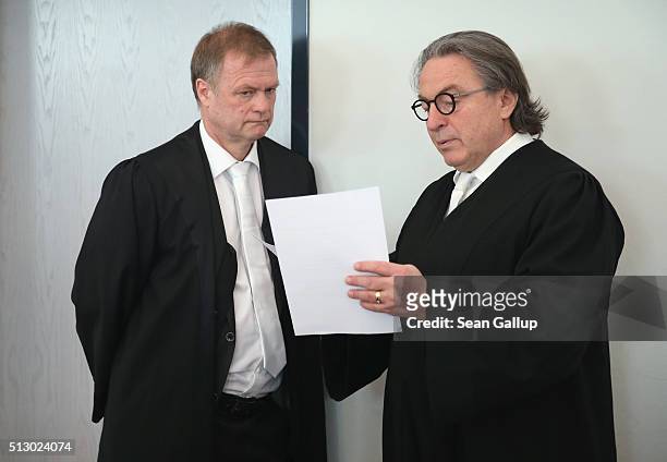 Defense attorneys Gerald Koelbl and Peter-Michael Diestel confer on the first day of the trial of Hubert Zafke, a former medic of the Waffen-SS who...