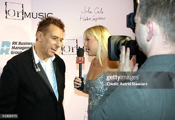 Personality Cecily Armstrong interviews singer John Cale at the John Cale Album Release Party during Olympus Fashion Week Spring 2005 on September...