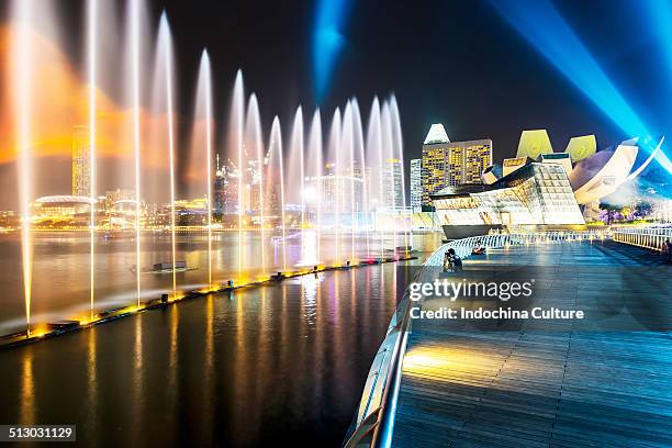 marina bay sands light and water show - singapore hotel stock pictures, royalty-free photos & images