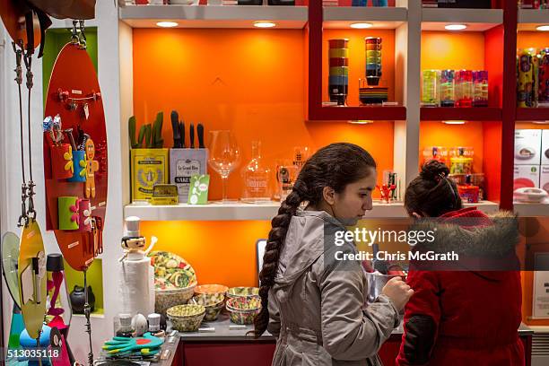 Syrian refugees, Reem, 15 and Ronak, 21 look in a novelty shop on Istiklal street on February 28, 2016 in Istanbul, Turkey. Turkey is currently on...