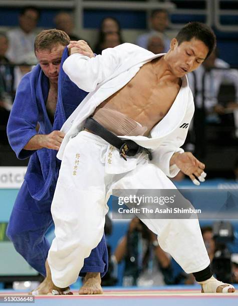 Tadahiro Nomura of Japan and Nestor Khergiani of Georgia compete in the Judo Men's -60kg final at the Ano Liossia Olympic Hall during day one of the...