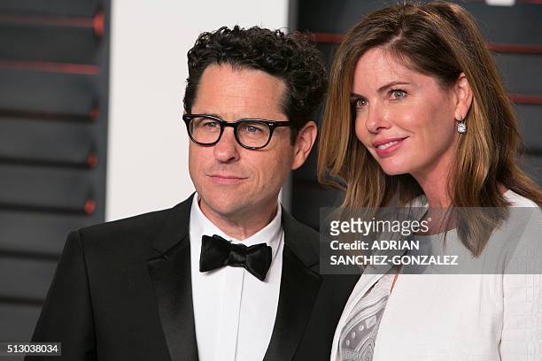 Director J.J. Abrams and his wife Katie McGrath pose as they arrive to the 2016 Vanity Fair Oscar Party in Beverly Hills, California on February 28,...