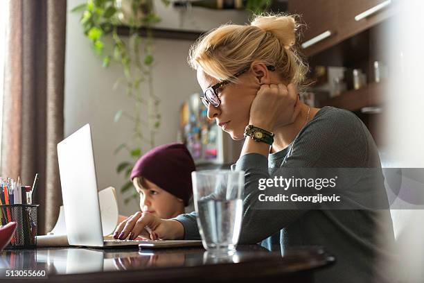 concentrated on her job - busy woman stockfoto's en -beelden