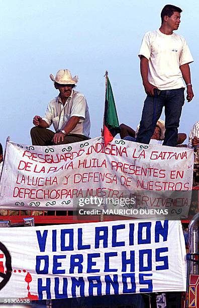Indigenous peasants rest on a truck 14 September, 2004 along the Pan American highway on the stretch between the cities of Quilichao and Villa Rica,...