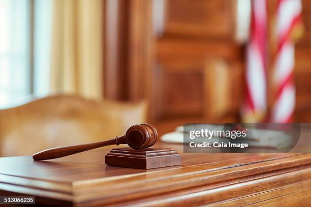 gavel laying on judges bench in courtroom - uk courtroom stock pictures, royalty-free photos & images