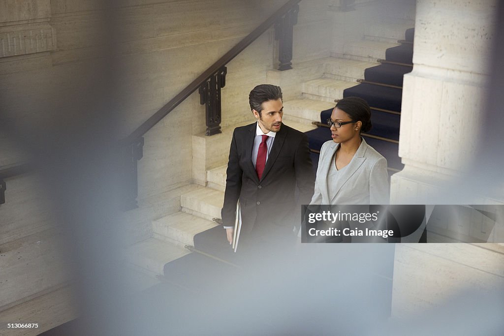 Lawyers walking downstairs in courthouse