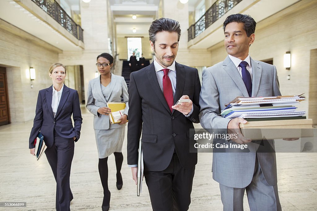 Lawyers walking in courthouse