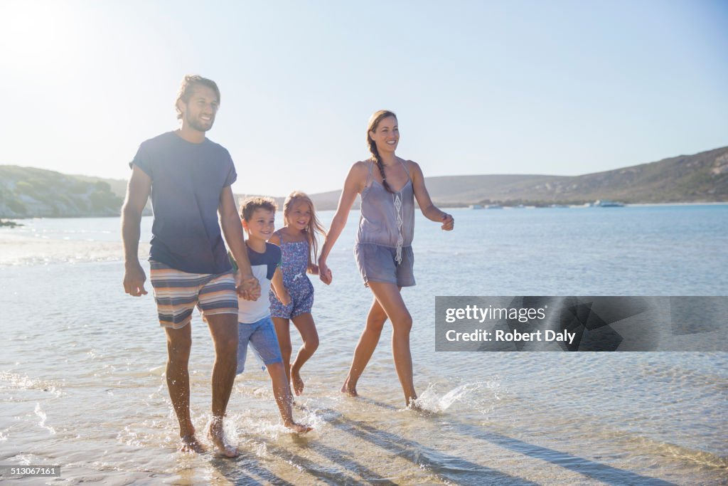 Family walking together along shore