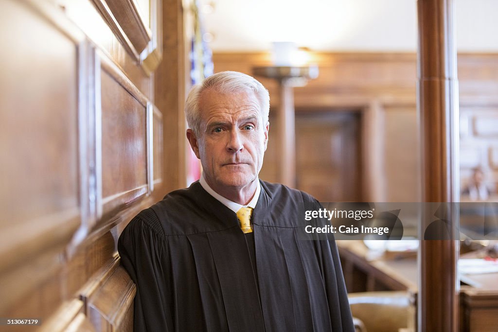 Judge standing in courtroom