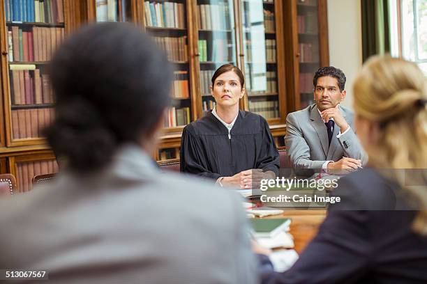 judge and lawyers talking in chambers - judge robe stock pictures, royalty-free photos & images
