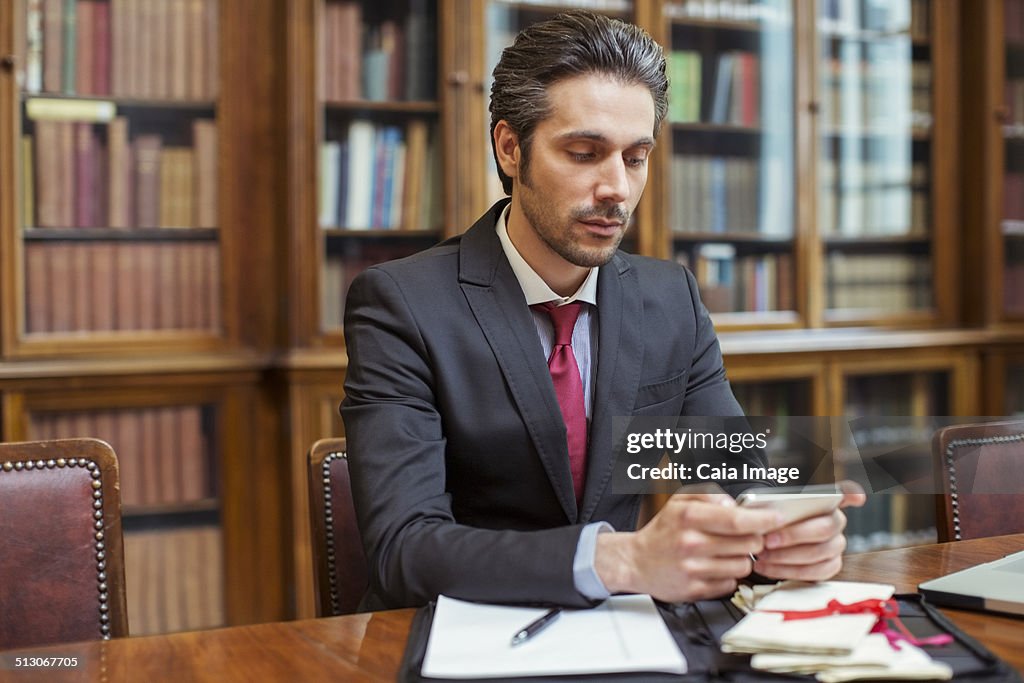 Lawyer working on cell phone in chambers