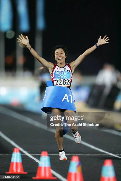 Mizuki Noguchi of Japan celebrates winning the gold in the Women's Marathon at the Panathinaiko Stadium during day nine of the Athens Olympics on...