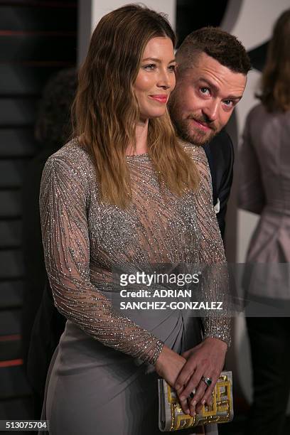 Singer Justin Timberlake and his wife US actress Jessica Biel pose as they arrive to the 2016 Vanity Fair Oscar Party in Beverly Hills, California on...